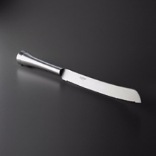 This Challah bread knife is another example of Nambe's elegant & modern styled giftware. A perfect compliment to the Nambe Kiddush cup and Sabbath candlesticks. This Challah bread knife is another example of Nambe's elegant & modern styled giftware. A perfect compliment to the Nambe Kiddush cup and Sabbath candlesticks.