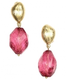 Appealing in pink. Jones New York's boldly beaded drop earrings combine pink plastic beads with a gold-plated mixed metal setting. Earrings have a clip-on backing for non-pierced ears. Approximate drop: 1-1/4 inches. Appealing in pink. Jones New York's boldly beaded drop earrings combine pink plastic beads with a gold-plated mixed metal setting. Earrings have a clip-on backing for non-pierced ears. Approximate drop: 1-1/4 inches.