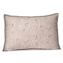 A delicately stitched sham, printed with floral branches and birds in muted hues of tan and pink. A delicately stitched sham, printed with floral branches and birds in muted hues of tan and pink.