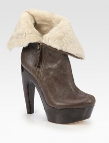 Crackled leather is paired with ultra-soft shearling in this foldover design, lifted by a wooden horn heel and platform. Wooden heel, 5½ (140mm)Wooden platform, 1½ (40mm)Compares to a 4 heel (100mm)Leather and shearling upperSide zipShearling linedLeather solePadded insoleImported Crackled leather is paired with ultra-soft shearling in this foldover design, lifted by a wooden horn heel and platform. Wooden heel, 5½ (140mm)Wooden platform, 1½ (40mm)Compares to a 4 heel (100mm)Leather and shearling upperSide zipShearling linedLeather solePadded insoleImported