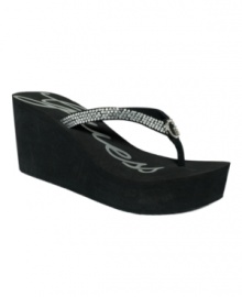 Keep your summer style sizzling with glamorous Sabrah wedge flip flops by GUESS. Keep your summer style sizzling with glamorous Sabrah wedge flip flops by GUESS.