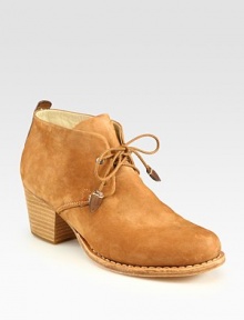 Vintage-inspired ankle boot of soft, pebbled leather has braided laces and a stacked heel. Stacked heel, 2 (50mm)Leather upperLeather lining and solePadded insoleImported Vintage-inspired ankle boot of soft, pebbled leather has braided laces and a stacked heel. Stacked heel, 2 (50mm)Leather upperLeather lining and solePadded insoleImported
