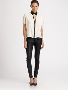 Delicate woven silk outlined with rich leather trim in a sexy menswear-inspired look.Button-front point collarDropped shouldersShort sleevesCutout v-neckAbout 22 from shoulder to hemBody: 92% silk/8% LycraTrim: leatherDry cleanMade in USA of imported fabricModel shown is 5'11 (180cm) wearing US size 4. Delicate woven silk outlined with rich leather trim in a sexy menswear-inspired look.Button-front point collarDropped shouldersShort sleevesCutout v-neckAbout 22 from shoulder to hemBody: 92% silk/8% LycraTrim: leatherDry cleanMade in USA of imported fabricModel shown is 5'11 (180cm) wearing US size 4.