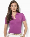 Rendered in soft stretch cotton mesh, Lauren Ralph Lauren's classic petite polo shirt is designed with a chic five-button placket and accented with an embroidered crest