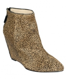Between the spotted upper and the large exposed zipper that runs along the back you'll love indulging in the gorgeous details of Juicy Couture's Astor wedges. Between the spotted upper and the large exposed zipper that runs along the back you'll love indulging in the gorgeous details of Juicy Couture's Astor wedges.