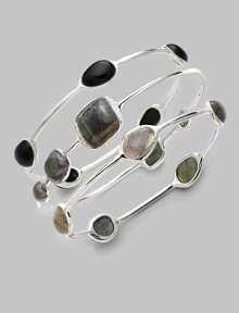 From the Scultura Collection. Five ovals of rich onyx cabochon are set in a graceful sterling silver bangle.Onyx cabochon Sterling silver Diameter, about 2¾ Imported