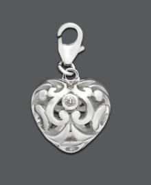 Add a drop of silver sophistication to any necklace or bracelet. This intricate scrolling heart charm features cubic zirconia accents. Set in sterling silver. Approximate drop: 1/2 inch. Add a drop of silver sophistication to any necklace or bracelet. This intricate scrolling heart charm features cubic zirconia accents. Set in sterling silver. Approximate drop: 1/2 inch.