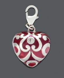 Put your heart into it. This intricate heart charm features a scrolling silver and cubic zirconia accent design. Crafted in sterling silver. Approximate drop: 1/2 inch. Put your heart into it. This intricate heart charm features a scrolling silver and cubic zirconia accent design. Crafted in sterling silver. Approximate drop: 1/2 inch.