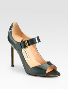 Sleek and chic patent leather silhouette with an extended back and adjustable Mary Jane strap. Self-covered heel, 4 (100mm)Patent leather upperLeather lining and solePadded insoleMade in Italy Sleek and chic patent leather silhouette with an extended back and adjustable Mary Jane strap. Self-covered heel, 4 (100mm)Patent leather upperLeather lining and solePadded insoleMade in Italy