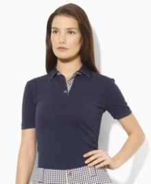 Rendered for easy, effortless movement in breathable cotton pique, the short-sleeved Lauren by Ralph Lauren polo shirt exudes modern, preppy style with bold gingham trim at the placket and collar. Rendered for easy, effortless movement in breathable cotton pique, the short-sleeved Lauren by Ralph Lauren polo shirt exudes modern, preppy style with bold gingham trim at the placket and collar.