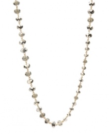 Stunning and stylish. Kenneth Cole New York's long station necklace is adorned with a chic combination of small, medium and large faceted glass accents in shimmering silver. Crafted in gold tone mixed metal. Approximate length: 42-1/2 inches. Stunning and stylish. Kenneth Cole New York's long station necklace is adorned with a chic combination of small, medium and large faceted glass accents in shimmering silver. Crafted in gold tone mixed metal. Approximate length: 42-1/2 inches.