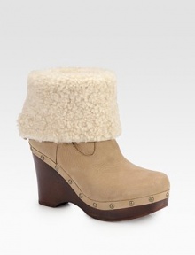 An on-trend leather essential featuring a plush shearling cuff, wooden heel and edgy metal studs. Wooden heel, 4 (100mm)Wooden platform, 1¼ (30mm)Compares to a 2¾ heel (70mm)Leather and shearling upperShearling liningRubber solePadded insoleImported An on-trend leather essential featuring a plush shearling cuff, wooden heel and edgy metal studs. Wooden heel, 4 (100mm)Wooden platform, 1¼ (30mm)Compares to a 2¾ heel (70mm)Leather and shearling upperShearling liningRubber solePadded insoleImported