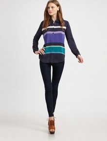 Lengthy silk top in a bold, vibrant stripe print with a point collar and long sleeves. Point collarButton frontLong sleevesButtoned cuffsLonger length hits below the hipsSilkDry cleanImportedModel shown is 5'10 (177cm) wearing US size Small.