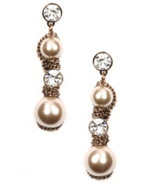 Put on the finishing touches. Givenchy's special occasion earrings shimmer with the addition of glass pearls and crystals. Set in unique brown gold-plated mixed metal. Approximate drop: 2-1/4 inches. Put on the finishing touches. Givenchy's special occasion earrings shimmer with the addition of glass pearls and crystals. Set in unique brown gold-plated mixed metal. Approximate drop: 2-1/4 inches.