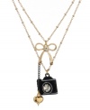 Pretty as a picture. A camera charm stands out stylishly on Betsey Johnson's double-row necklace. Adorned with bow and heart charms, it's accented by dazzling crystals. Made in gold tone mixed metal, it comes with a signature gift box. Approximate length: 16 inches + 3-inch extender. Approximate drop: 3/4 inch.