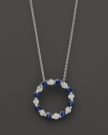 Diamond and sapphire circle pendant in 14K white gold. Diamond and sapphire circle pendant in 14K white gold.