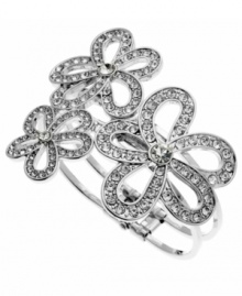 Dazzle them with this flirtatiously feminine design. GUESS's sparkling crystal bracelet will have you going cuff crazy. Design features three, cut-out flowers set in silver tone mixed metal. Secures with a hinge clasp. Approximate diameter: 2-3/4 inches. Dazzle them with this flirtatiously feminine design. GUESS's sparkling crystal bracelet will have you going cuff crazy. Design features three, cut-out flowers set in silver tone mixed metal. Secures with a hinge clasp. Approximate diameter: 2-3/4 inches.