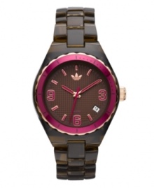 Time for dessert. Chocolate brown and candy pink are perfect on this Cambridge watch by adidas. Brown translucent plastic bracelet and round nylon case with gold tone and pink aluminum bezel. Brown grid-patterned dial features pink numerals at three, six and nine o'clock, stick indices, date window at four o'clock, three hands and logo. Quartz movement. Water resistant to 50 meters. Two-year limited warranty. Time for dessert. Chocolate brown and candy pink are perfect on this Cambridge watch by adidas. Brown translucent plastic bracelet and round nylon case with gold tone and pink aluminum bezel. Brown grid-patterned dial features pink numerals at three, six and nine o'clock, stick indices, date window at four o'clock, three hands and logo. Quartz movement. Water resistant to 50 meters. Two-year limited warranty.