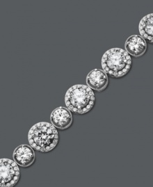 Enlighten your look with a little Arabella. This glamorous tennis bracelet features a unique circular design that highlights dozens of round-cut Swarovski zirconias (22-9/10 ct. t.w.). Crafted in sterling silver. Approximate length: 7 inches. Enlighten your look with a little Arabella. This glamorous tennis bracelet features a unique circular design that highlights dozens of round-cut Swarovski zirconias (22-9/10 ct. t.w.). Crafted in sterling silver. Approximate length: 7 inches.