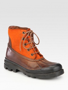 Traditional hunting style with mixed media elements of felt and leather, finished with a rubber sole for rugged durability.Leather/felt upperLeather liningPadded insoleRubber soleMade in Italy Traditional hunting style with mixed media elements of felt and leather, finished with a rubber sole for rugged durability.Leather/felt upperLeather liningPadded insoleRubber soleMade in Italy