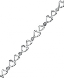 Follow your heart. Victoria Townsend's adorable bracelet features a row of open-cut hearts and shining diamond accents in sterling silver. Approximate length: 7 inches. Follow your heart. Victoria Townsend's adorable bracelet features a row of open-cut hearts and shining diamond accents in sterling silver. Approximate length: 7 inches.