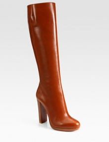 Richly hued leather in a knee-high silhouette with a side zipper, sky-high heel and signature red leather sole. Stacked heel, 4 (100mm)Covered platform, ½ (15mm)Compares to a 3½ heel (90mm)Shaft, 15½Leg circumference, 14Leather upperSide zipperLeather liningSignature red leather solePadded insoleMade in ItalyOUR FIT MODEL RECOMMENDS ordering one size up as this style runs small. Richly hued leather in a knee-high silhouette with a side zipper, sky-high heel and signature red leather sole. Stacked heel, 4 (100mm)Covered platform, ½ (15mm)Compares to a 3½ heel (90mm)Shaft, 15½Leg circumference, 14Leather upperSide zipperLeather liningSignature red leather solePadded insoleMade in ItalyOUR FIT MODEL RECOMMENDS ordering one size up as this style runs small.