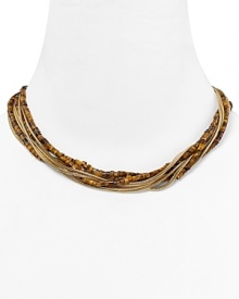 Follow your feline instincts and flaunt MICHAEL Michael Kors' tiger's eye torsade necklace--the captivating collar lend exotic flair to staple tees or femme blouses. Follow your feline instincts and flaunt MICHAEL Michael Kors' tiger's eye torsade necklace--the captivating collar lend exotic flair to staple tees or femme blouses.