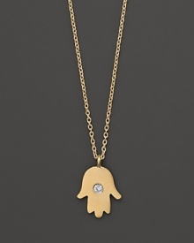 A diamond adds sparkle to a 14K. yellow gold hamsa necklace by Meira T. A diamond adds sparkle to a 14K. yellow gold hamsa necklace by Meira T.