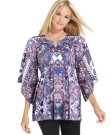 A vibrant print and statement silhouette make this top from Style&co. eye-catching. A vibrant print and statement silhouette make this top from Style&co. eye-catching.