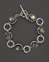 Hammered sterling silver links shine on a modern Ippolita bracelet, detailed with dazzling pyrite doublets.