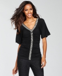 Beading and ruching together create a soft, feminine look for INC's fitted top. Beading and ruching together create a soft, feminine look for INC's fitted top.