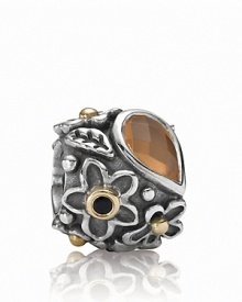An orange moonstone 'dew drop' stone grounds a sterling silver PANDORA charm with a gold and onyx-accented floral motif. An orange moonstone 'dew drop' stone grounds a sterling silver PANDORA charm with a gold and onyx-accented floral motif.