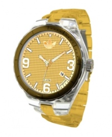 Work out with a watch worthy of a gold medal. Cambridge collection by adidas. Gold tone anodized aluminum bracelet and round clear nylon case with gold tone bezel. Grid-patterned gold tone dial features numerals at three, six and nine o'clock, stick indices, date window at four o'clock, luminous hands and logo. Quartz movement. Water resistant to 50 meters. Two-year limited warranty.