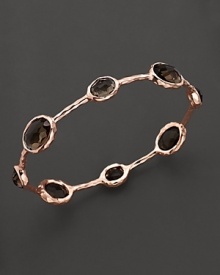 From the Rosé collection, eight smoky quartz stations on a hammered bangle. Designed by Ippolita. From the Rosé collection, eight smoky quartz stations on a hammered bangle. Designed by Ippolita.