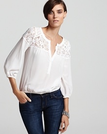 A silk BCBGMAXAZRIA top flaunts a chic lace yoke and lovely blouson sleeves for an easy season of romance and femininity. A silk BCBGMAXAZRIA top flaunts a chic lace yoke and lovely blouson sleeves for an easy season of romance and femininity.