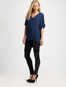 Featherweight crepe in a sexy v-neck tunic that hangs just-so off the body.V-neckDropped shouldersCuffed sleevesContour hemBack gathered below yokeRayonDry cleanImportedModel shown is 5'8½ (174cm) wearing US size Small. Featherweight crepe in a sexy v-neck tunic that hangs just-so off the body.V-neckDropped shouldersCuffed sleevesContour hemBack gathered below yokeRayonDry cleanImportedModel shown is 5'8½ (174cm) wearing US size Small.