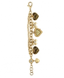 Right on time and straight from the heart. Charm bracelet watch by Betsey Johnson crafted of gold tone stainless steel multichain bracelet with two crystal-accented bow charms, two leopard print heart charms and one plain gold tone heart. Gold tone, heart-shaped case with champagne dial features gold tone dot markers at three, six and nine o'clock, two hands and logo. Quartz movement. Water resistant to 30 meters. Two-year limited warranty.