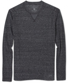 This cozy heathered long-sleeve t-shirt from Calvin Klein Jeans is perfect for layering looks. This cozy heathered long-sleeve t-shirt from Calvin Klein Jeans is perfect for layering looks.