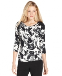Calvin Klein's printed top features a fitted silhouette and flattering ruching. Calvin Klein's printed top features a fitted silhouette and flattering ruching.