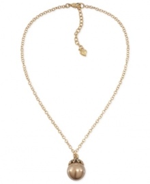 Have yourself a ball with this pendant necklace from Carolee. Crafted from gold-tone mixed metal, the necklace gets a bit of glamour with a glass pearl pendant at the center. Approximate length: 16 inches. Approximate drop: 1 inch. Have yourself a ball with this pendant necklace from Carolee. Crafted from gold-tone mixed metal, the necklace gets a bit of glamour with a glass pearl pendant at the center. Approximate length: 16 inches. Approximate drop: 1 inch.