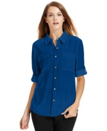 Calvin Klein's button-front blouse offers a new take on a stylish staple thanks to knit panels at the sides. Calvin Klein's button-front blouse offers a new take on a stylish staple thanks to knit panels at the sides.