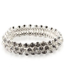 An elegant finishing touch from Anne Klein. Glass and plastic stones in clear hues lend a look of sophistication to this bracelet. Crafted in silver tone mixed metal. Approximate diameter: 2 inches. Stretches to fit wrist. An elegant finishing touch from Anne Klein. Glass and plastic stones in clear hues lend a look of sophistication to this bracelet. Crafted in silver tone mixed metal. Approximate diameter: 2 inches. Stretches to fit wrist.