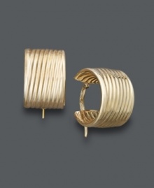 An absolute must-have for every girl's accessory collection. These stunning hoops feature a unique, ribbed design crafted in 14k gold. Approximate diameter: 3/8 inch.