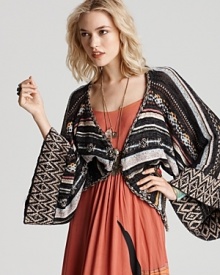 This Free People cardigan layers on the luxe--a gorgeous addition to your all-season collection. With kimono sleeves and golden buttons, the striped cover-up conceals with chic. This Free People cardigan layers on the luxe--a gorgeous addition to your all-season collection. With kimono sleeves and golden buttons, the striped cover-up conceals with chic.