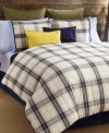 Tommy Hilfiger's Lake George duvet cover set features a classic plaid design in olive, blue and ivory tones accented with pops of yellow. Finished with blue tape binding for a clean look. Reverses to solid.
