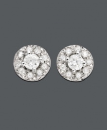 Dust your earlobes with diamond studs. Practical for every occasion, these circular studs feature one central round-cut diamond surrounded by slightly smaller round-cut diamonds (1/4 ct. t.w.) at the edges. Earrings crafted in 14k white gold. Approximate diameter: 1/4 inch. Dust your earlobes with diamond studs. Practical for every occasion, these circular studs feature one central round-cut diamond surrounded by slightly smaller round-cut diamonds (1/4 ct. t.w.) at the edges. Earrings crafted in 14k white gold. Approximate diameter: 1/4 inch.