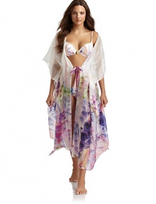 THE LOOKPastel flower print with shimmery pearlescent finishKimono-inspired sleevesDrawstring sash ties at waistTHE FITAbout 51 from shoulder to hemTHE MATERIAL67% silk/33% nylonCARE & ORIGINHand washImported