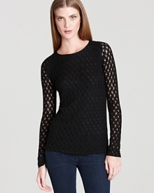 This body-skimming knit top from DIANE von FURSTENBERG works just as well with sleek skinny jeans as it does tucked into a chic pencil skirt. This body-skimming knit top from DIANE von FURSTENBERG works just as well with sleek skinny jeans as it does tucked into a chic pencil skirt.