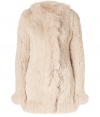 Exquisitely soft and equally luxurious, Matthew Williamsons rabbit fur coat is a glamorous investment tailored to multi-season sophistication - Collarless with fox fur trim, long sleeves, fox fur cuffs, hidden front hook closures - Long fitted silhouette - Pair with edgy leather separates and a finish of statement accessories