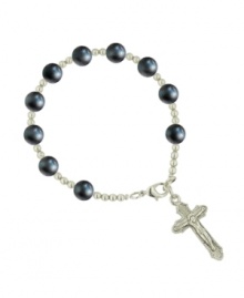 Share your faith in style with rosary-themed jewelry by Vatican. Bracelet features an intricate crucifix charm strung on a delicate chain with dark blue cat's eye beads. Setting and chain crafted in silver tone mixed metal. Approximate length: 7 inches. Approximate drop: 1-1/4 inches. Share your faith in style with rosary-themed jewelry by Vatican. Bracelet features an intricate crucifix charm strung on a delicate chain with dark blue cat's eye beads. Setting and chain crafted in silver tone mixed metal. Approximate length: 7 inches. Approximate drop: 1-1/4 inches.